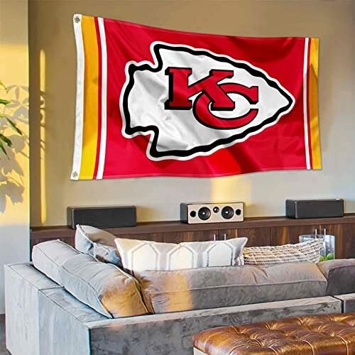 Kansas City Chiefs flag hanging in a living room.