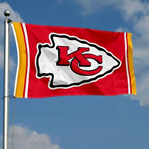 Kansas City Chiefs flag waving on a pole.